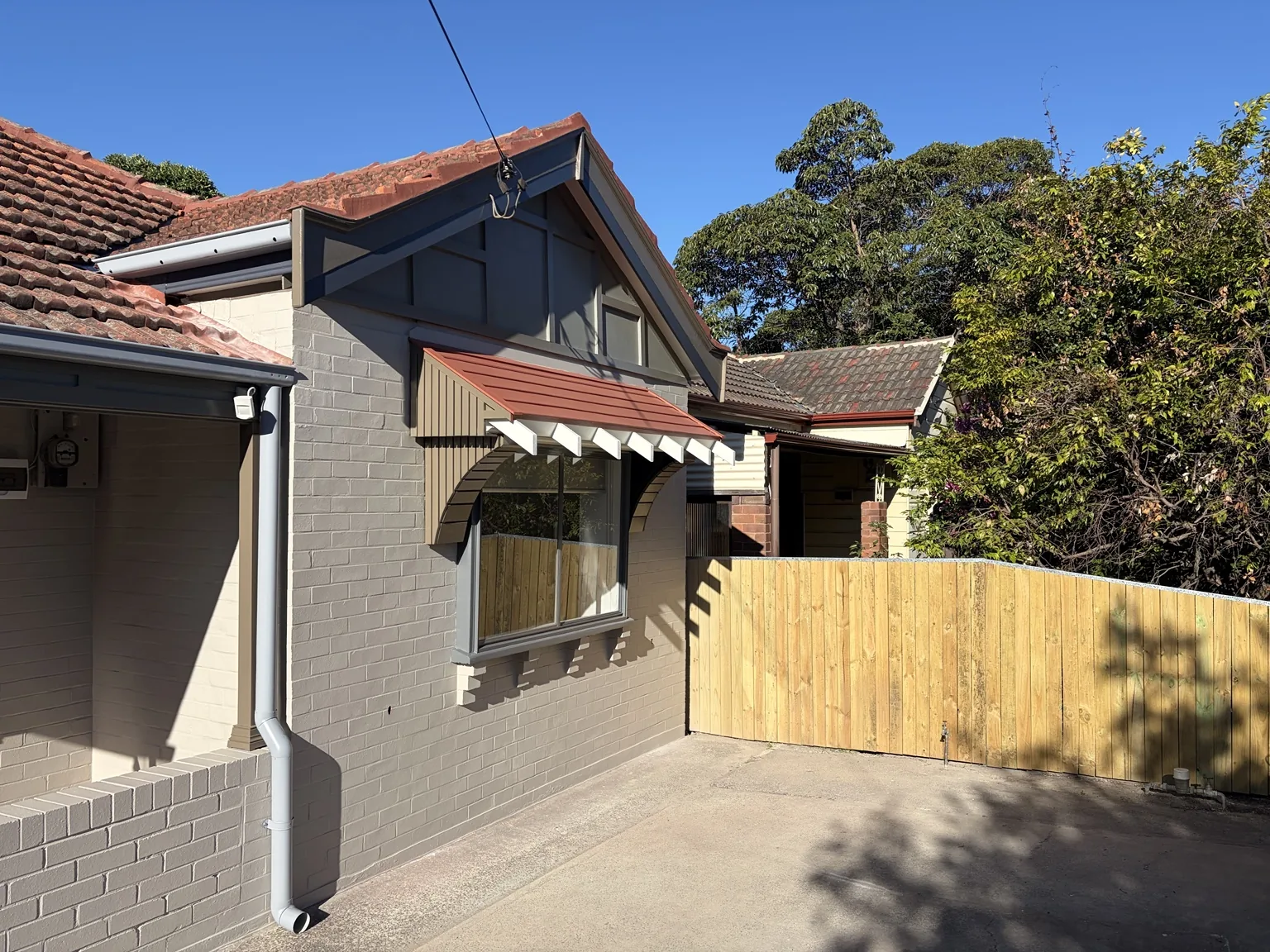 Completed painted brick facade and awning